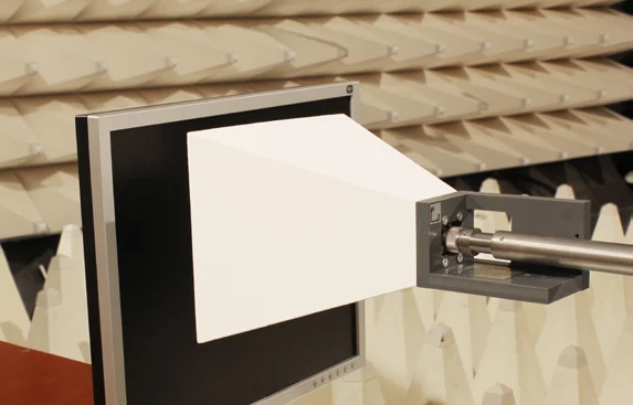 Teseq TEM horn in front of a monitor inside an anechoic chamber